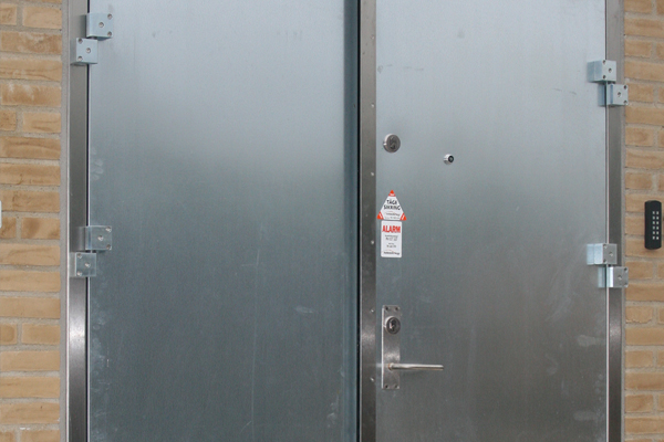 Hinged steel door mounted in a Netto store