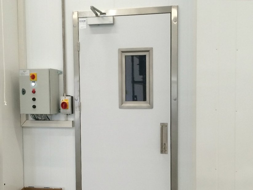 Hinged freezer room door