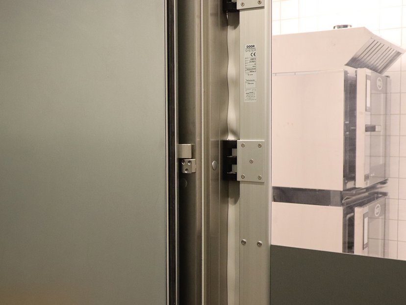 Customised door solution at coop365 store, hinges