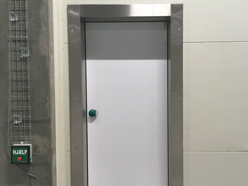 Hinged freezer room door on facade 