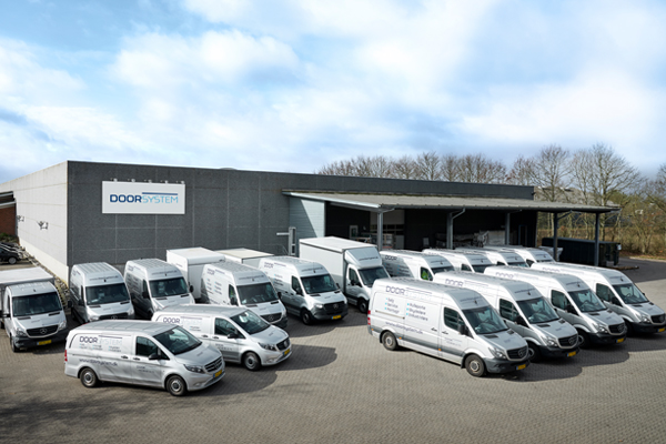 Door System service cars parked by the factory